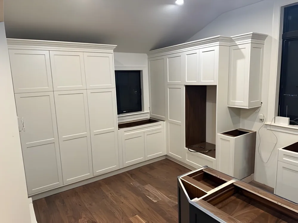 Custom kitchen cabinet installation with full-height cabinetry