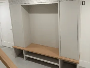 Custom mudroom built-in with bench and open storage